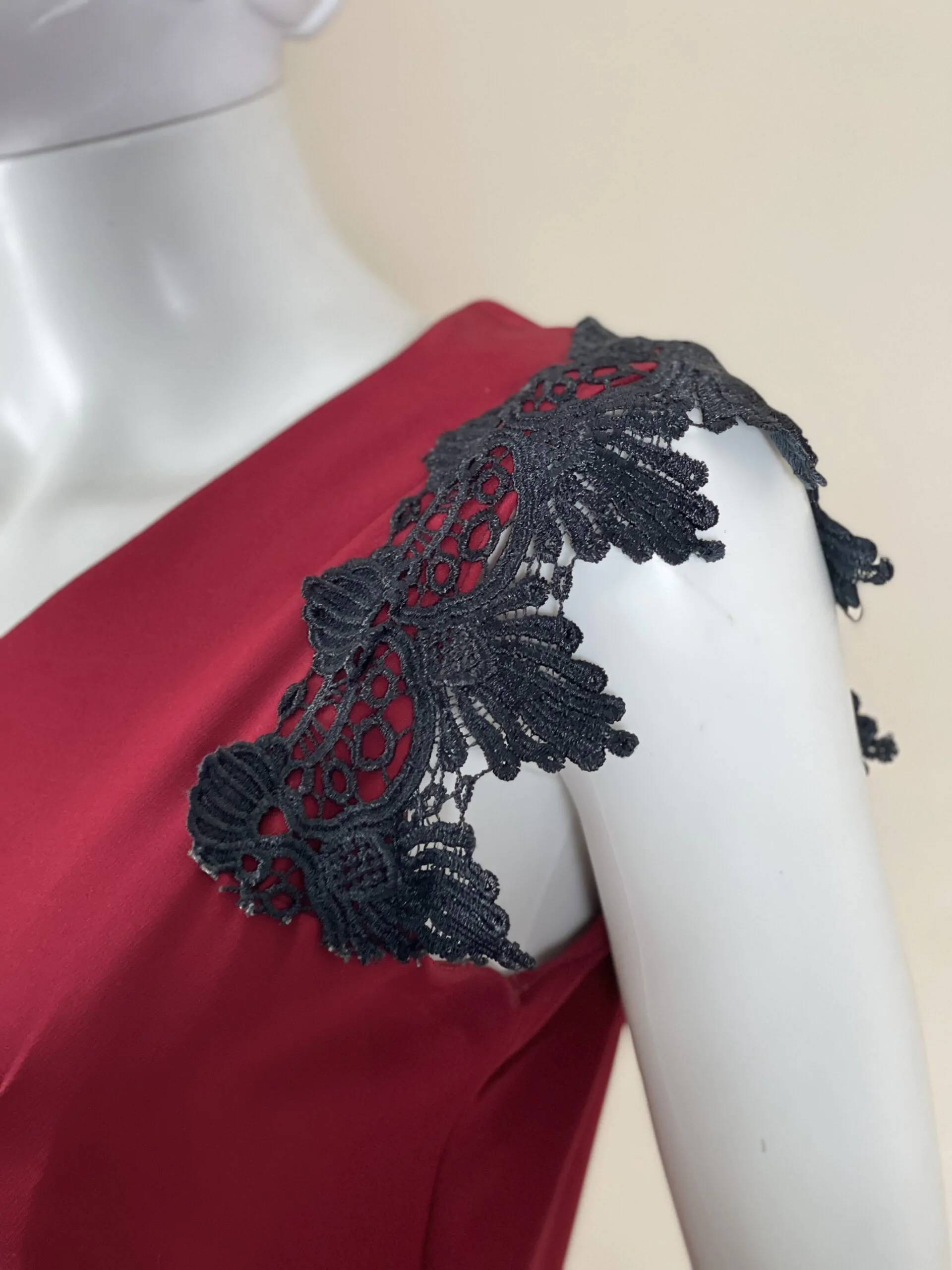 Red dress with black lace from the shoulder and bottom