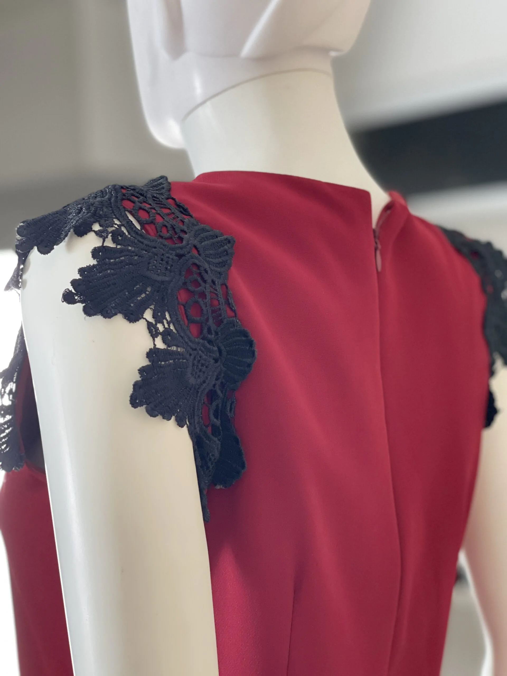 Red dress with black lace from the shoulder and bottom